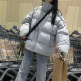Jaqueta de inverno feminina curto coreano solto pão 2023 novo solto sólido preto quente streetwear moda escondida fivela bolha casaco
