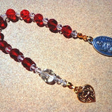 Saint Agnes rosary, gold tone cross, red and clear glass