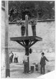 Prisoners in pillory,tied to whipping post,man whit whip,prison,Delaware,DE,1905